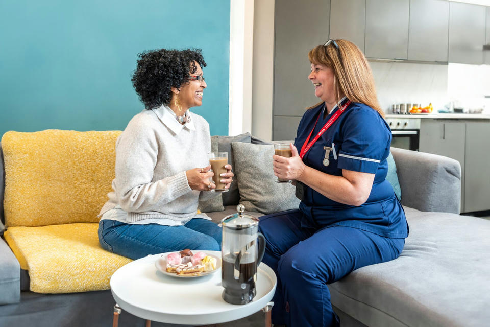 atos-medical-purpose-values nurse and tracheostomy patient having coffee